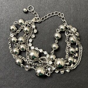 Multi strand silver tone bracelet